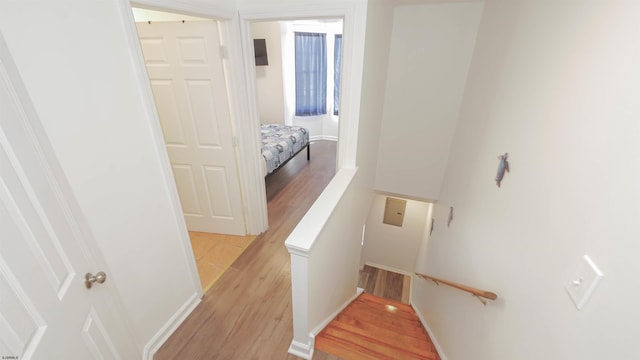 stairs with hardwood / wood-style floors