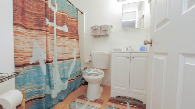 bathroom featuring tile patterned floors, a shower with curtain, vanity, and toilet