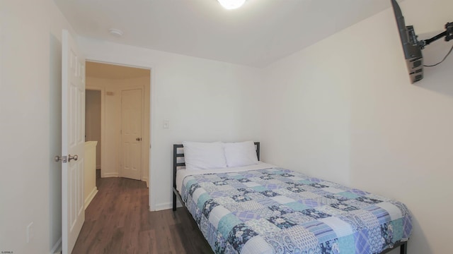 bedroom featuring dark hardwood / wood-style flooring