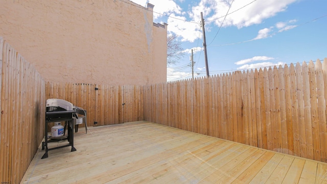 wooden deck with grilling area