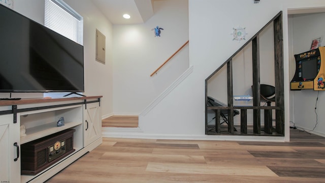 stairs featuring hardwood / wood-style flooring