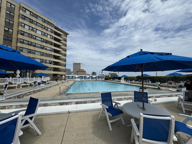 view of pool featuring a patio