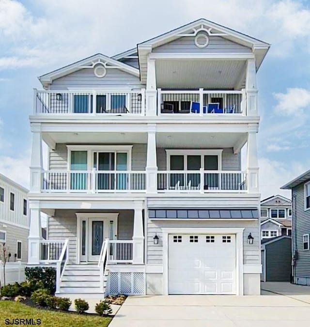 view of front facade with a garage and covered porch