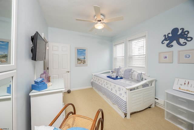 bedroom with ceiling fan, light carpet, and a baseboard radiator