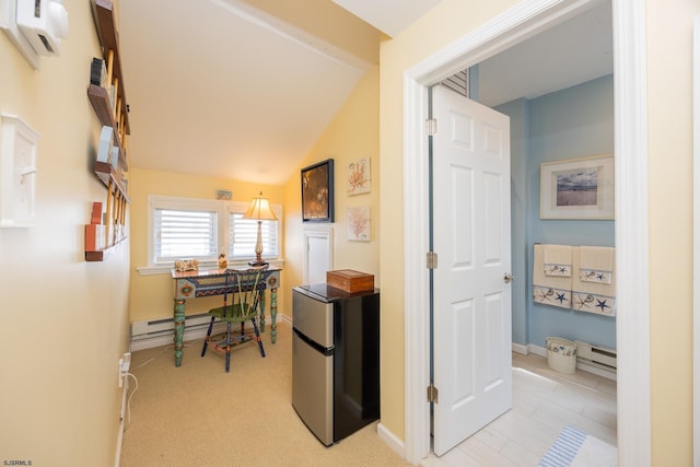 hall featuring an AC wall unit, a baseboard radiator, light colored carpet, and lofted ceiling