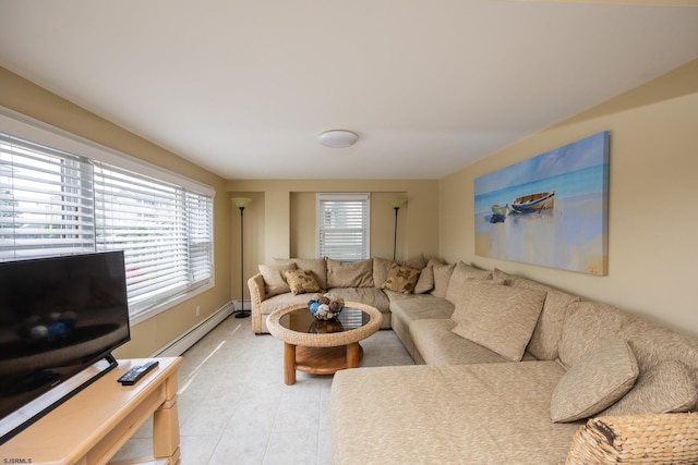 living room featuring a baseboard radiator and a wealth of natural light