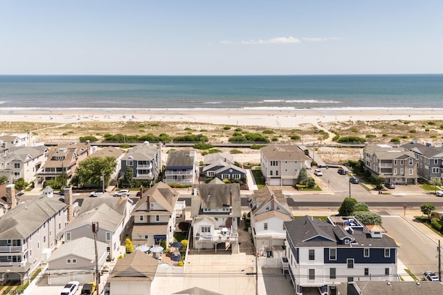 bird's eye view with a water view and a view of the beach