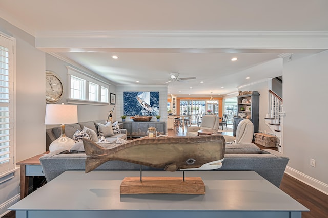 living room featuring dark hardwood / wood-style floors, ceiling fan, and crown molding