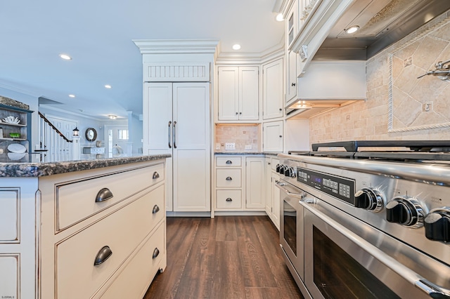 kitchen with white cabinetry, range with two ovens, dark wood-type flooring, and dark stone countertops