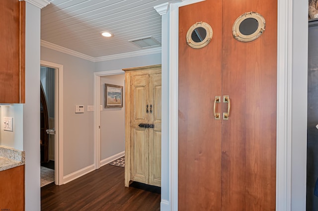 corridor featuring dark wood-type flooring and ornamental molding