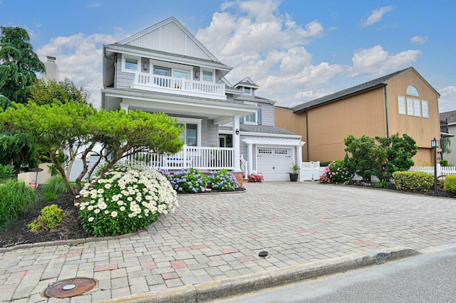 view of front of house with a balcony and covered porch