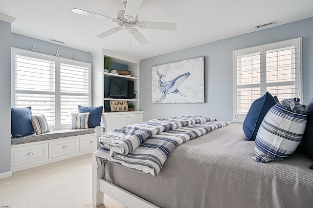 carpeted bedroom with ceiling fan