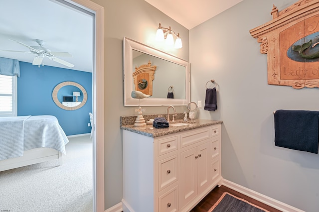 bathroom featuring ceiling fan and vanity