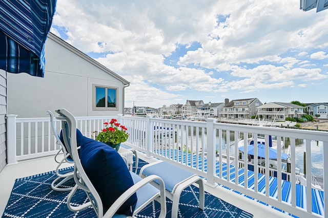 balcony featuring a water view