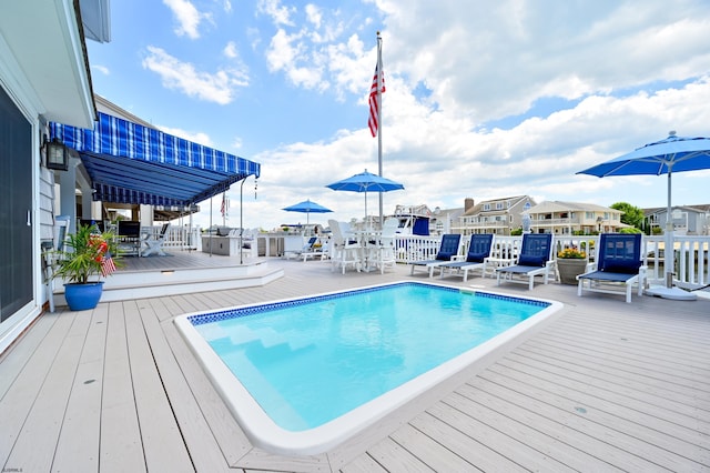 view of pool with a deck