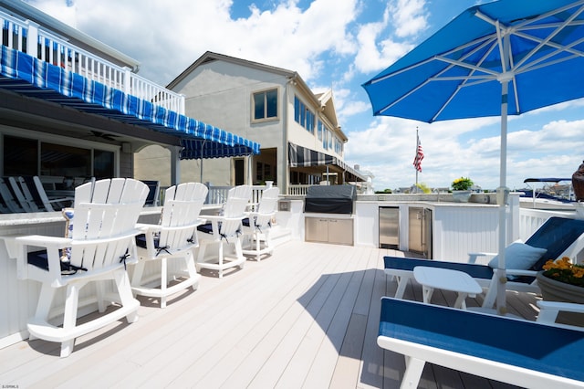 wooden deck featuring a grill and area for grilling