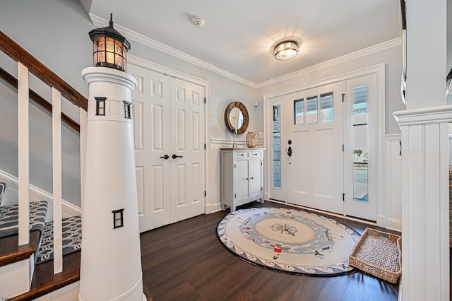 entryway featuring crown molding and dark hardwood / wood-style floors