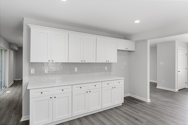 kitchen with white cabinetry and tasteful backsplash