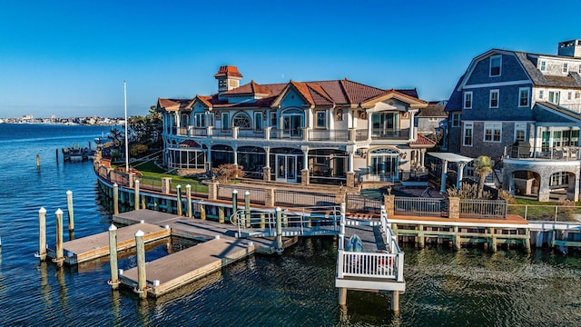 view of dock featuring a balcony and a water view