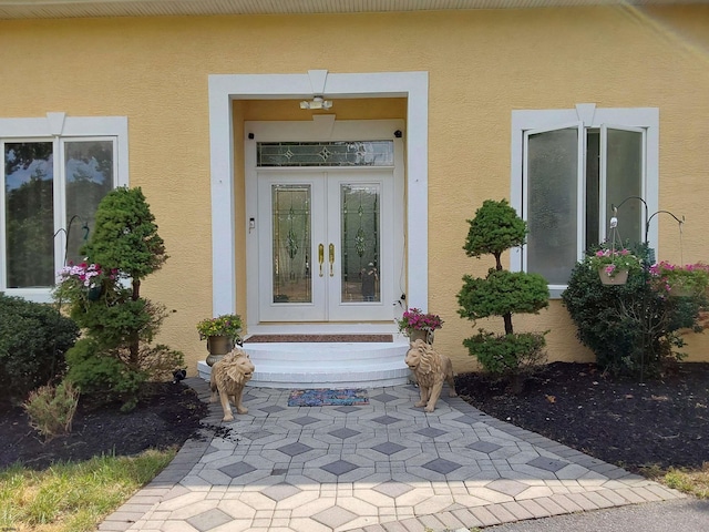 entrance to property featuring french doors