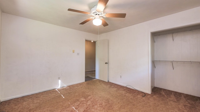 unfurnished bedroom featuring carpet flooring, ceiling fan, and a closet