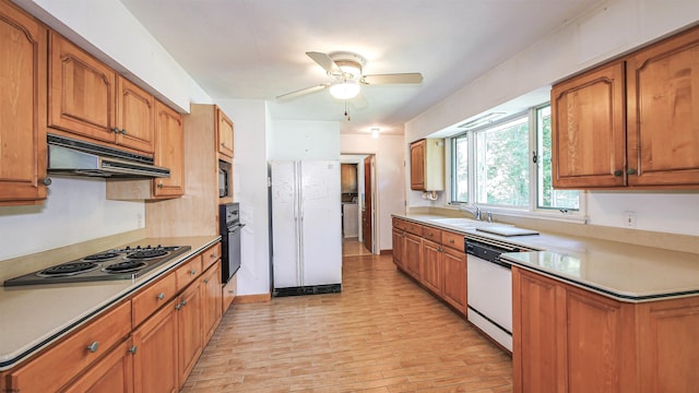 kitchen featuring white appliances, extractor fan, ceiling fan, and sink