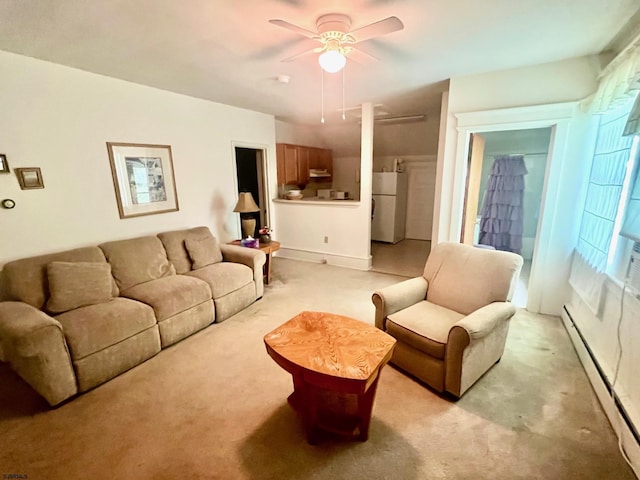 carpeted living room featuring baseboard heating and ceiling fan