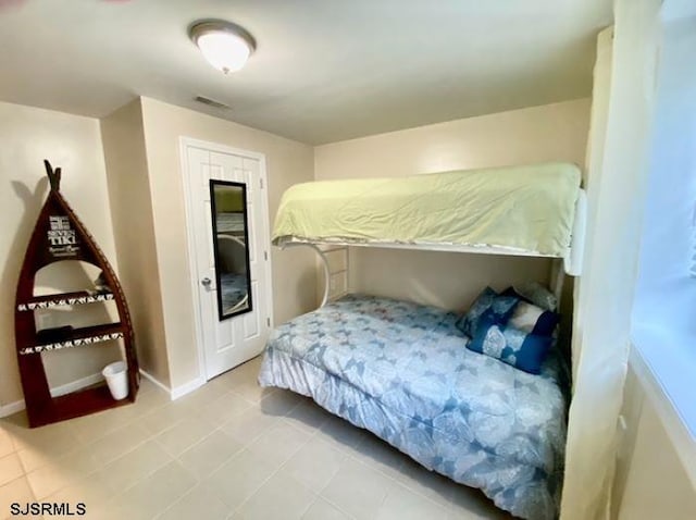 bedroom featuring tile patterned floors