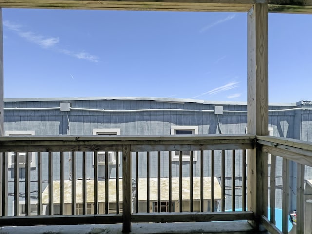 deck featuring a beach view and a water view