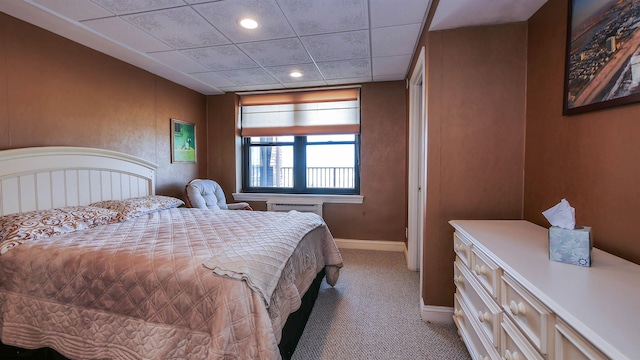 bedroom featuring light carpet