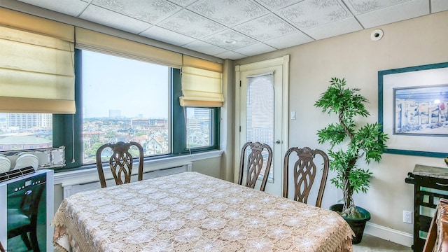 dining space featuring a paneled ceiling