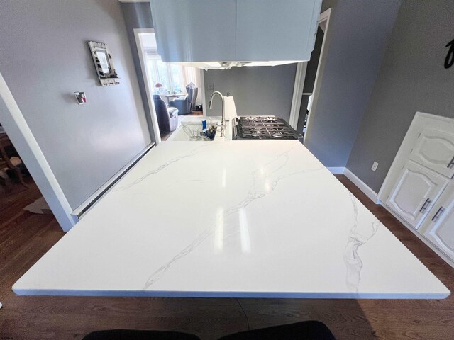 dining space featuring crown molding, hardwood / wood-style floors, and a baseboard radiator