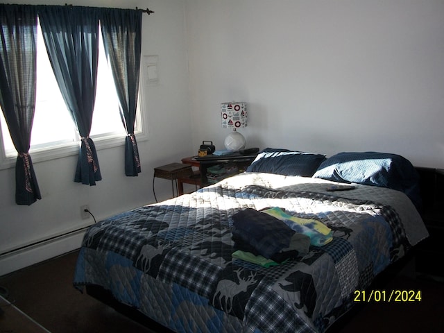 bedroom with a baseboard radiator