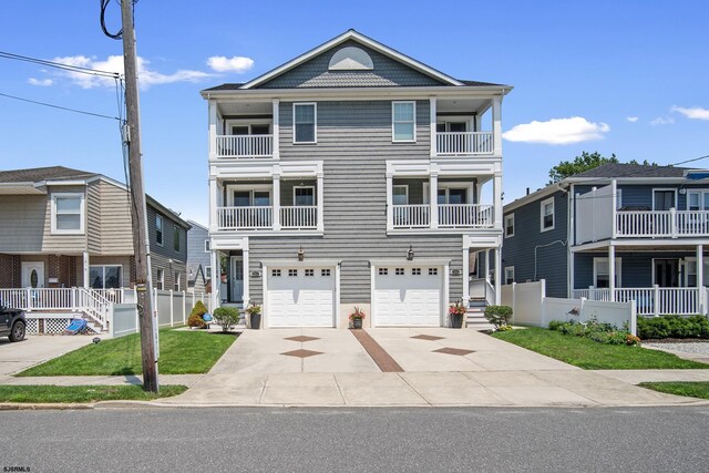 view of front facade with a garage and a balcony