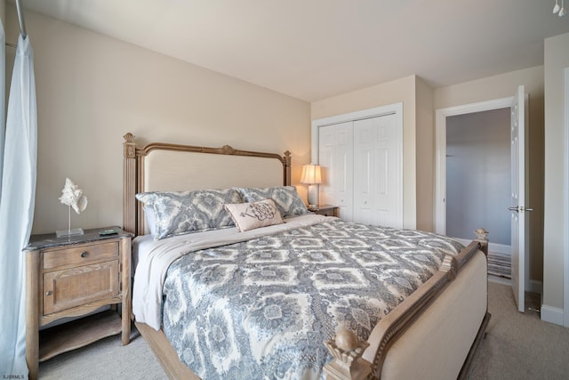 bedroom with light carpet and a closet