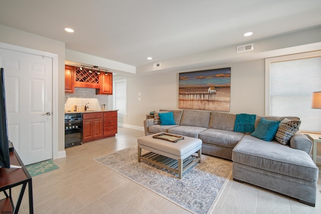 living room featuring indoor wet bar