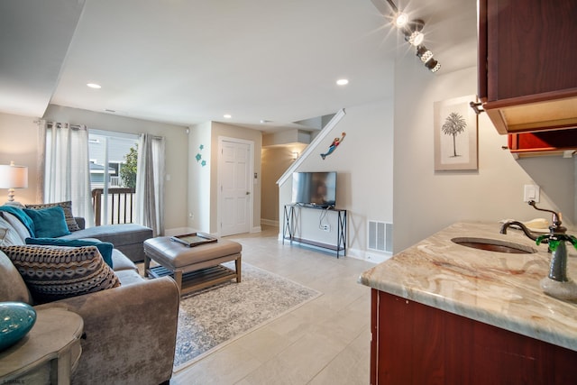 living room featuring sink