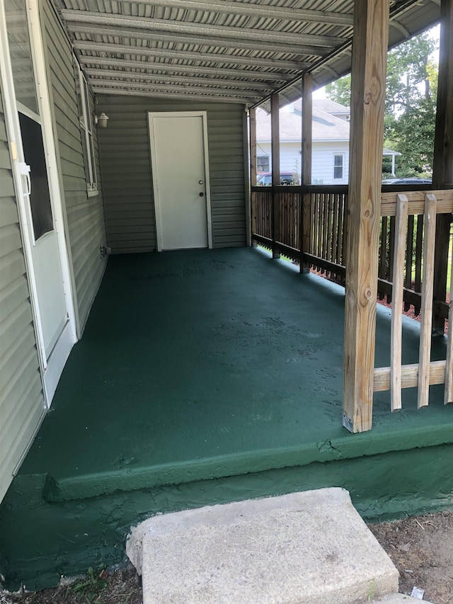 view of patio / terrace featuring a carport