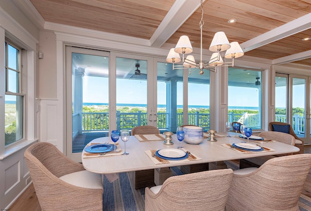 dining room featuring french doors, wood-type flooring, beamed ceiling, and wooden ceiling