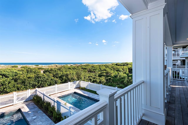 view of pool featuring a water view