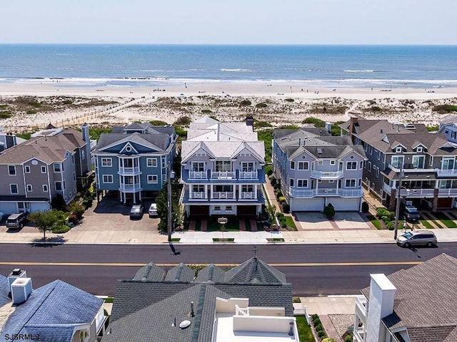 drone / aerial view with a view of the beach and a water view