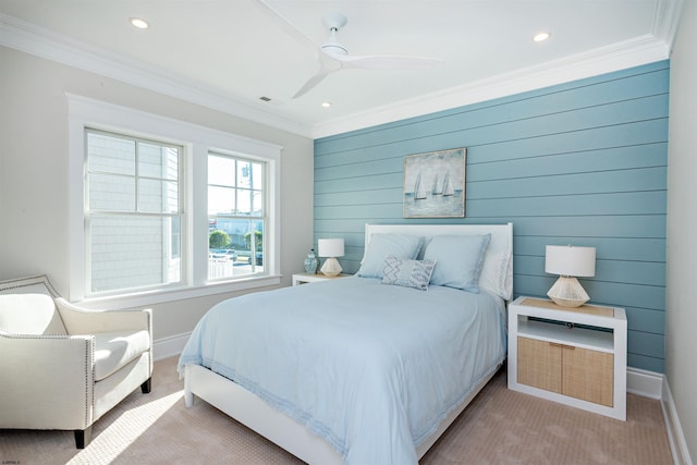 carpeted bedroom with ceiling fan and crown molding