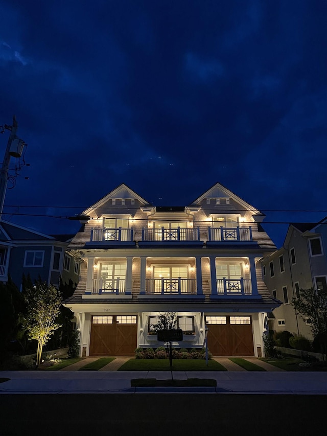 multi unit property with a balcony and a garage