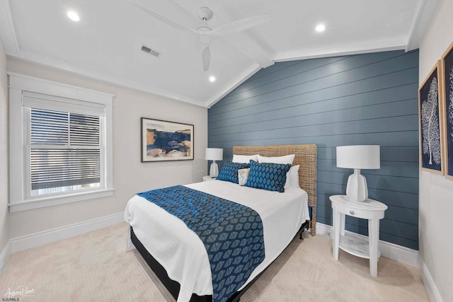 carpeted bedroom featuring ceiling fan, lofted ceiling with beams, and wooden walls