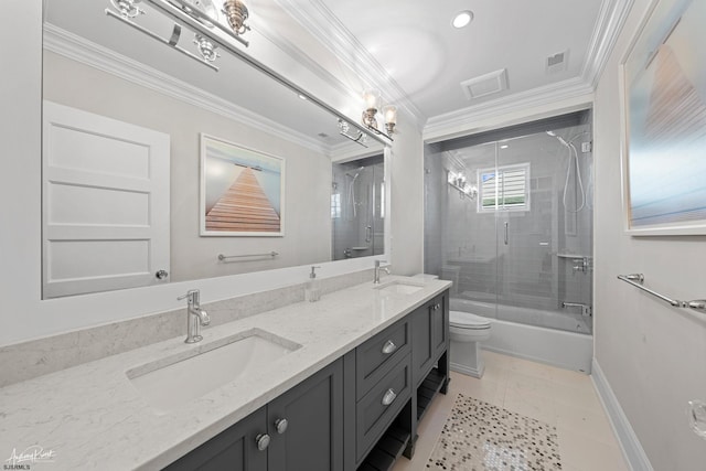 full bathroom featuring shower / bath combination with glass door, tile patterned floors, vanity, toilet, and ornamental molding