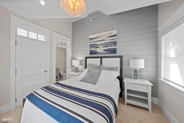 bedroom featuring ornamental molding and light carpet