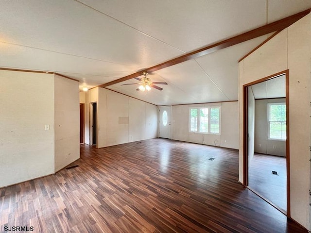 empty room featuring ceiling fan, dark hardwood / wood-style flooring, and lofted ceiling with beams