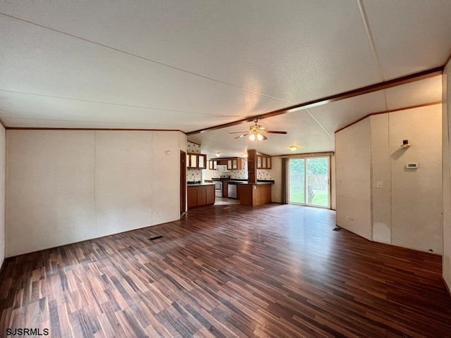 unfurnished living room with vaulted ceiling, ceiling fan, and dark hardwood / wood-style floors