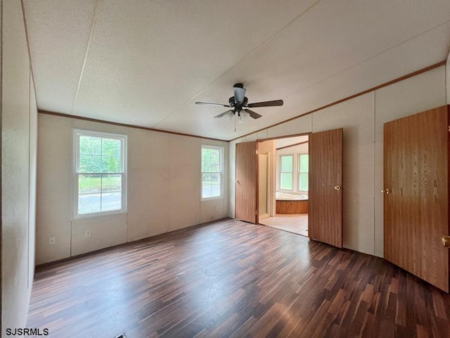 unfurnished room with ceiling fan, lofted ceiling, ornamental molding, and hardwood / wood-style floors