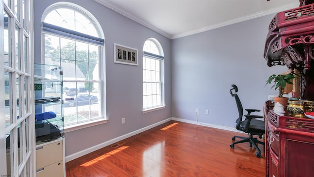 home office featuring crown molding and hardwood / wood-style floors